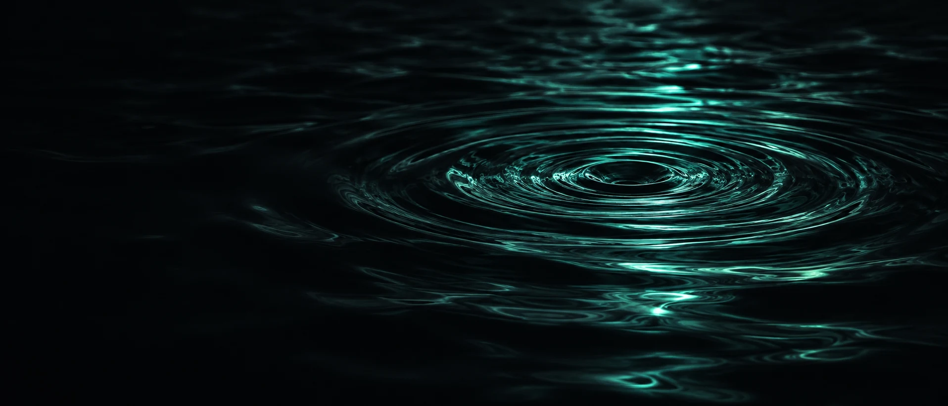 Dark ocean surface at night with a single faint teal ripple spreading across it